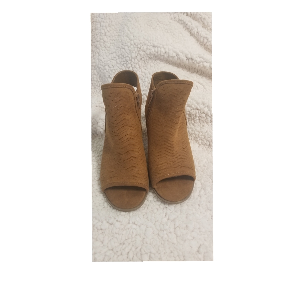 Brown booties with cutouts.